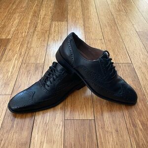 Donald J Pliner wingtip dress shoes.